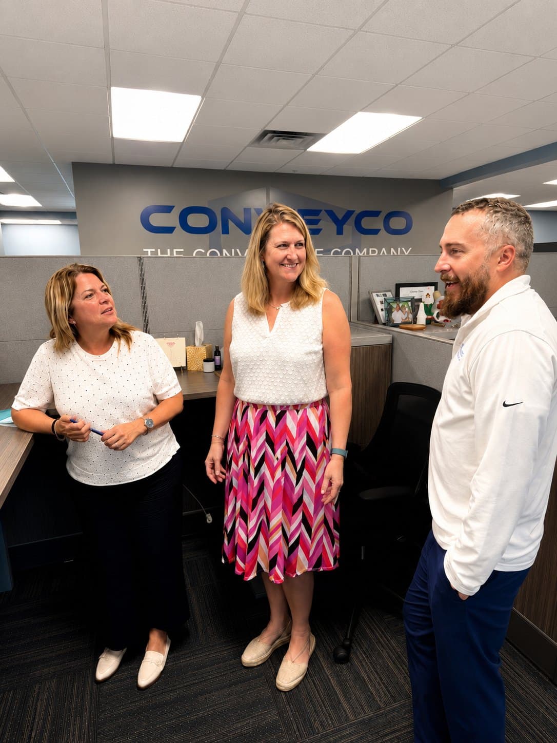 Conveyco team members reviewing shipment paperwork together